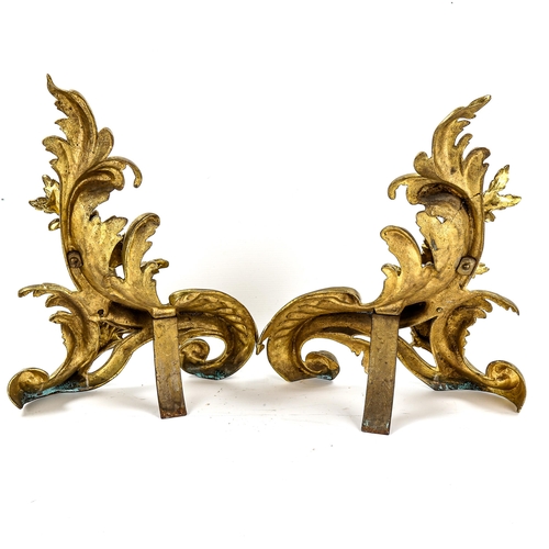 1132 - A pair of gilt-bronze Rococo style chenet fire dogs, height 38cm