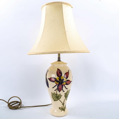 1143 - MOORCROFT POTTERY - a table lamp and shade, overall height 64cm