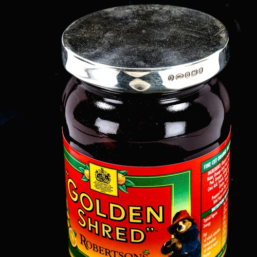 1150 - A jar of Robertson's Golden Shred Marmalade, with hallmarked silver lid, boxed