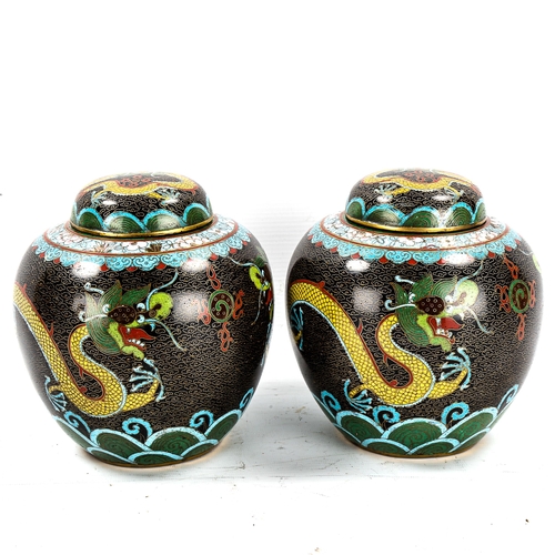 1155 - A pair of Chinese cloisonne enamel jars and covers, with dragon designs, height 18cm