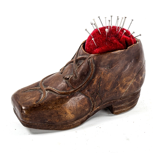 1160 - A 19th century Black Forest treen shoe design pin cushion, length 11cm