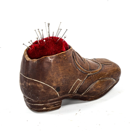 1160 - A 19th century Black Forest treen shoe design pin cushion, length 11cm