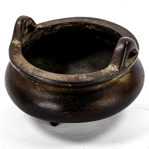 1175 - A Chinese patinated bronze incense burner, impressed seal mark under base, diameter 14cm