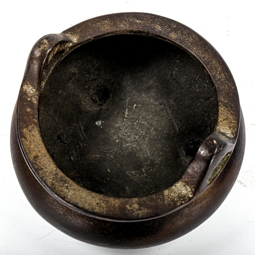 1175 - A Chinese patinated bronze incense burner, impressed seal mark under base, diameter 14cm