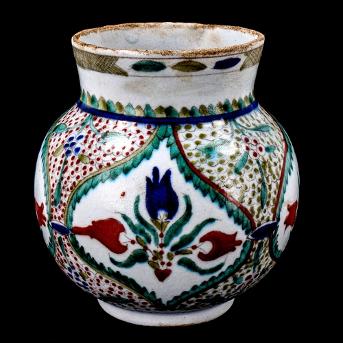 1212 - A Turkish Kutahya pottery vase with painted decoration, height 14cm