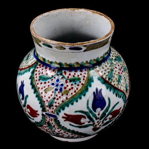 1212 - A Turkish Kutahya pottery vase with painted decoration, height 14cm