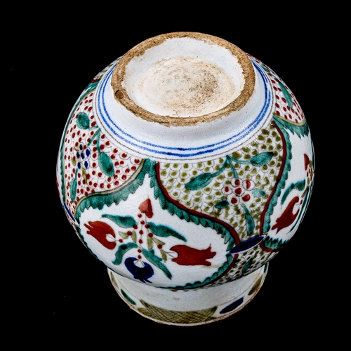 1212 - A Turkish Kutahya pottery vase with painted decoration, height 14cm