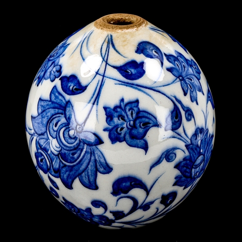 1213 - A Turkish blue and white pottery hanging ball ornament, height 13cm