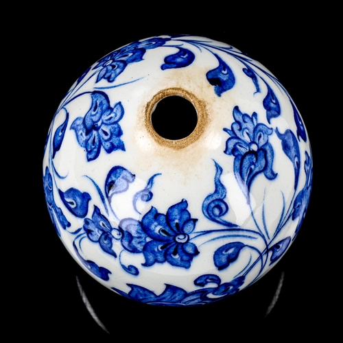 1213 - A Turkish blue and white pottery hanging ball ornament, height 13cm