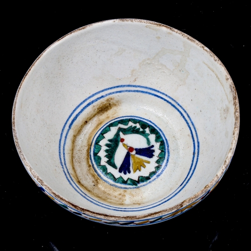 1216 - A Turkish Kutahya pottery bowl with painted decoration, diameter 12.5cm