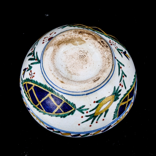 1216 - A Turkish Kutahya pottery bowl with painted decoration, diameter 12.5cm