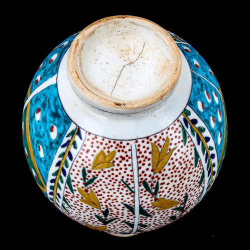 1218 - A Turkish Kutahya pottery vase with painted decoration, height 18cm