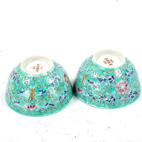 1225 - A pair of Chinese porcelain rice bowls, with enamel bat designs on turquoise ground, character marks... 