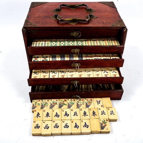 1227 - A Chinese bone and bamboo Mahjong set, in original brass-bound hardwood cabinet, with brass carrying... 