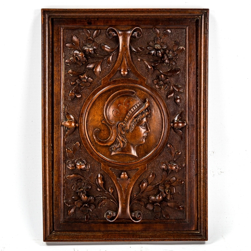 1229 - A fine relief carved walnut Classical wall plaque, with central panel depicting a Greek warrior, 23.... 