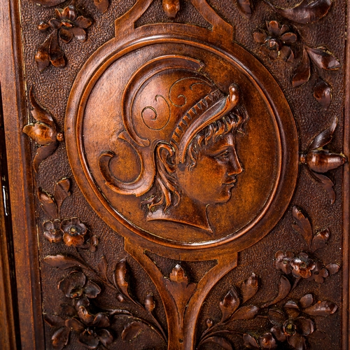 1229 - A fine relief carved walnut Classical wall plaque, with central panel depicting a Greek warrior, 23.... 