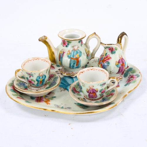 1250 - A Chinese famille rose porcelain doll's tea service on matching tray, tray length 14cm