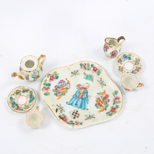 1250 - A Chinese famille rose porcelain doll's tea service on matching tray, tray length 14cm