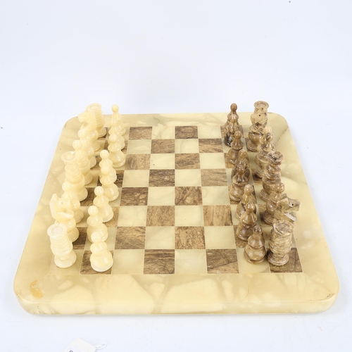 1273 - An onyx chess set on onyx games board