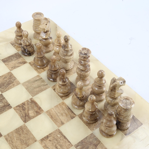 1273 - An onyx chess set on onyx games board