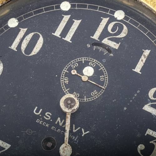 68 - A brass US Navy Deck bulkhead Clock No. 1, by Seth Thomas, black dial with Arabic numerals and subsi... 