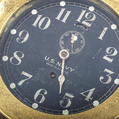 68 - A brass US Navy Deck bulkhead Clock No. 1, by Seth Thomas, black dial with Arabic numerals and subsi... 