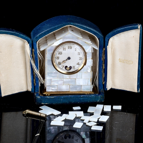 69 - A small early 20th century French mother-of-pearl architectural house clock, engine turned silvered ... 