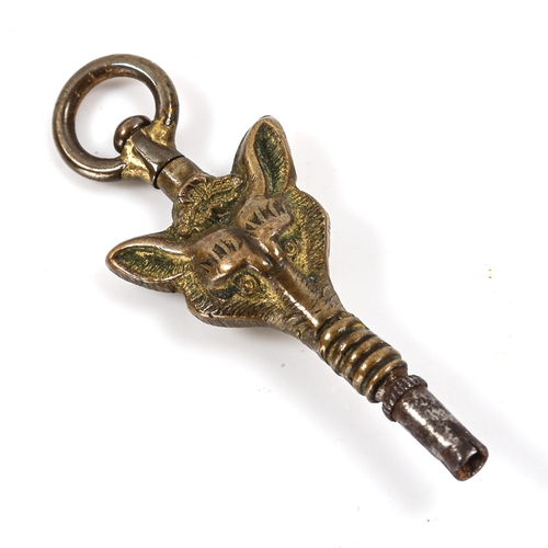 87 - A 19th century novelty brass fox mask pocket watch key, length 39mm