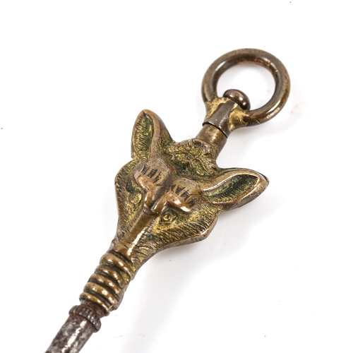 87 - A 19th century novelty brass fox mask pocket watch key, length 39mm