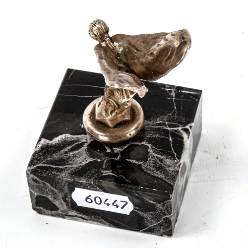 1205 - A small electroplate Spirit of Ecstacy car mascot, on marble base, height 9cm