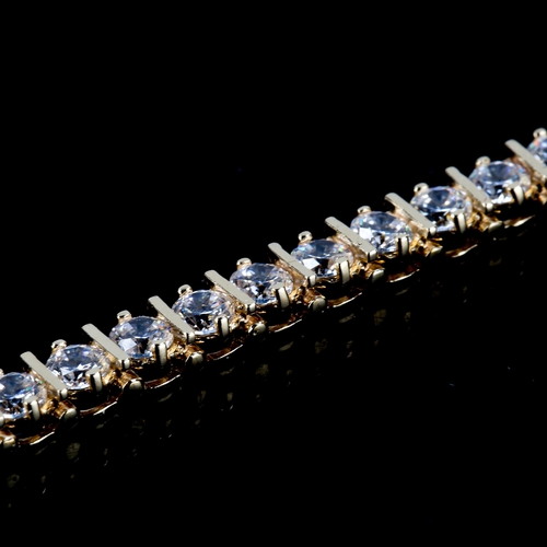 112 - A 14ct gold diamond tennis line bracelet, set with modern round brilliant-cut diamonds, total diamon... 