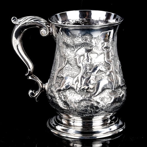 114 - A George II silver pint mug, baluster form with relief embossed stag hunting scene and scrolled acan... 