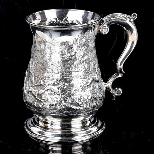 114 - A George II silver pint mug, baluster form with relief embossed stag hunting scene and scrolled acan... 