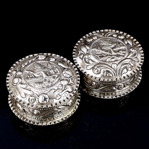 121 - A pair of Antique Continental silver toilet boxes and covers, circa 1890, possibly Scandinavian, rel... 