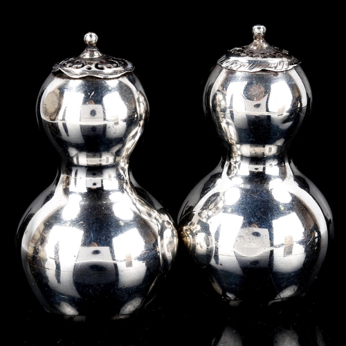 124 - A pair of Victorian silver double-gourd pepperettes, by Willian Hutton & Sons Ltd, hallmarks London ... 