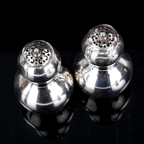 124 - A pair of Victorian silver double-gourd pepperettes, by Willian Hutton & Sons Ltd, hallmarks London ... 