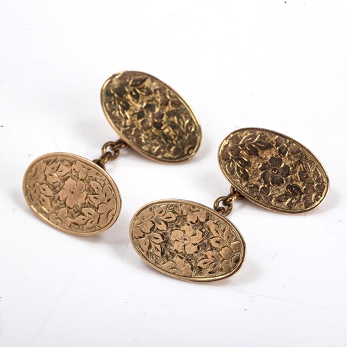 130 - A pair of late Victorian 9ct rose gold oval panel cufflinks, engraved floral decoration, hallmarks B... 