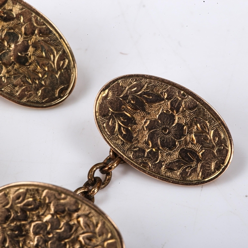 130 - A pair of late Victorian 9ct rose gold oval panel cufflinks, engraved floral decoration, hallmarks B... 