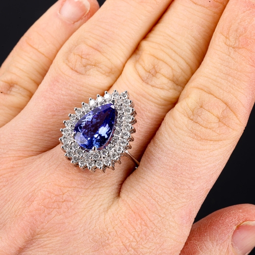 134 - A large modern 18ct white gold tanzanite and diamond pear cluster ring, set with pear-cut tanzanite ... 