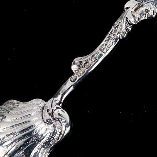 144 - A Victorian cast-silver salt shovel spoon, textured shell bowl with foliate handle, by Henry Holland... 