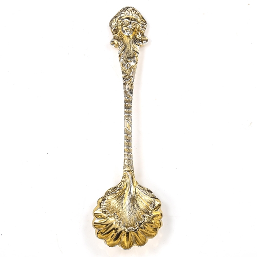 145 - A late Victorian cast silver-gilt salt spoon, shell and acanthus leaf bowl with figurehead terminal,... 