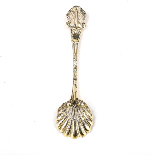 145 - A late Victorian cast silver-gilt salt spoon, shell and acanthus leaf bowl with figurehead terminal,... 