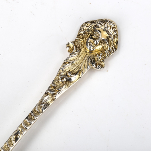 145 - A late Victorian cast silver-gilt salt spoon, shell and acanthus leaf bowl with figurehead terminal,... 