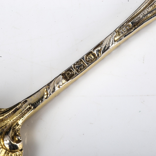 145 - A late Victorian cast silver-gilt salt spoon, shell and acanthus leaf bowl with figurehead terminal,... 