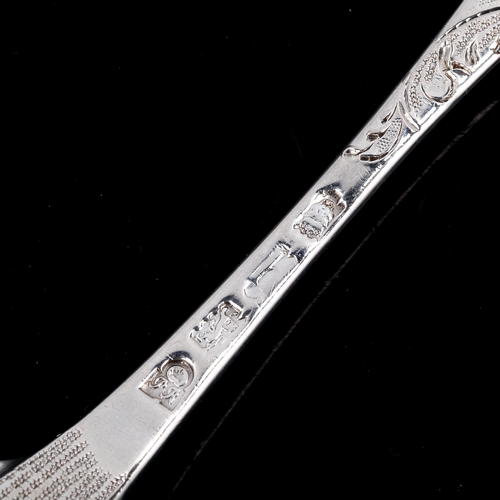 146 - A George II silver berry spoon, all over engraved and embossed decoration, by Philip Roker II, hallm... 