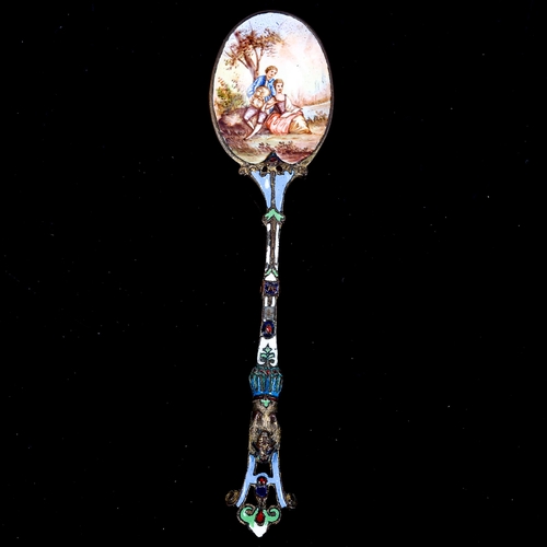 148 - An Austrian Viennese enamel spoon, brass base metal with a hand painted enamel lover decoration, len... 