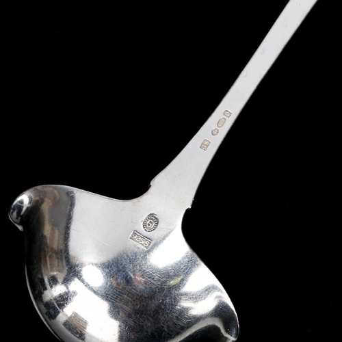 151 - GEORG JENSEN - an early 20th century Danish stylised sterling silver sauce ladle, import hallmarks L... 