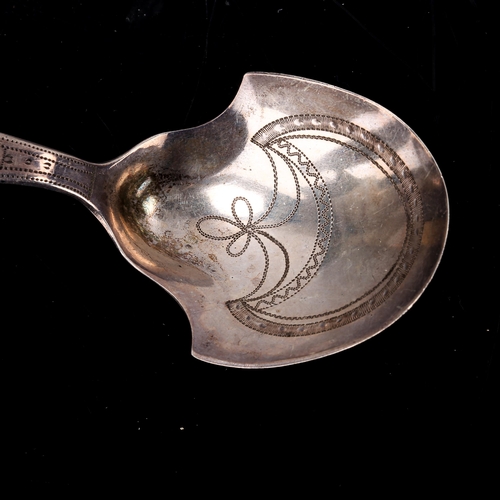 153 - A George III silver shovel caddy spoon, bright-cut engraved decoration, maker's marks IT, possibly J... 