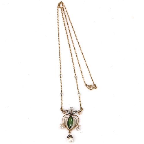 162 - An Edwardian Art Nouveau green tourmaline pearl and diamond pendant necklace, unmarked gold openwork... 