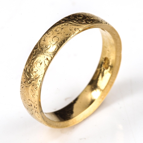 163 - A heavy Victorian 18ct gold wedding band ring, engraved foliate decoration, maker's marks GB, hallma... 